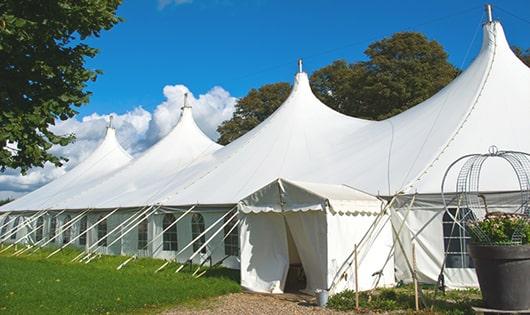 a line of sleek and modern portable restrooms ready for use at an upscale corporate event in Ferris